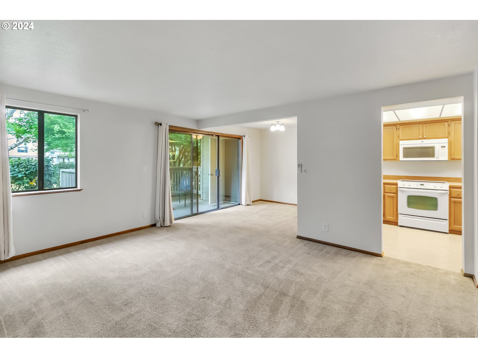 2051 Lake Isle Terrace Eugene, OR 97401 - Photo 6 of 36 a view of an empty room with a window