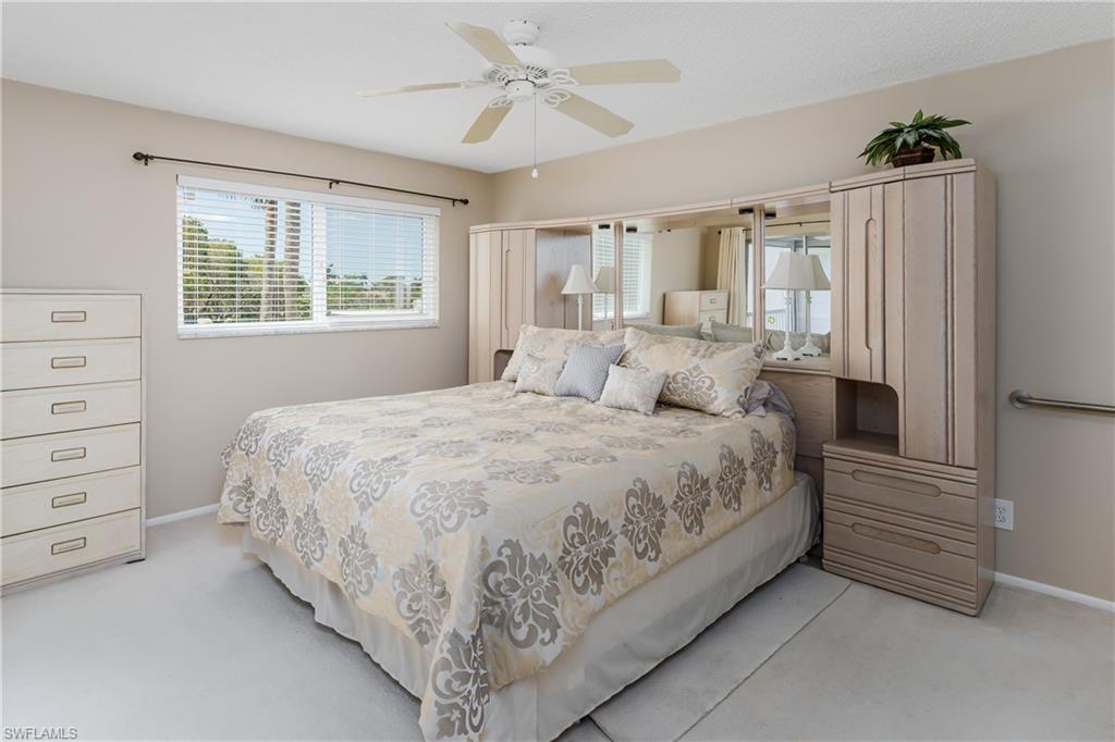 5515 Rattlesnake Hammock Road, Unit 205 Naples, FL 34113 - Photo 12 of 46 Dining area with a ceiling fan, visible vents, and light colored carpet