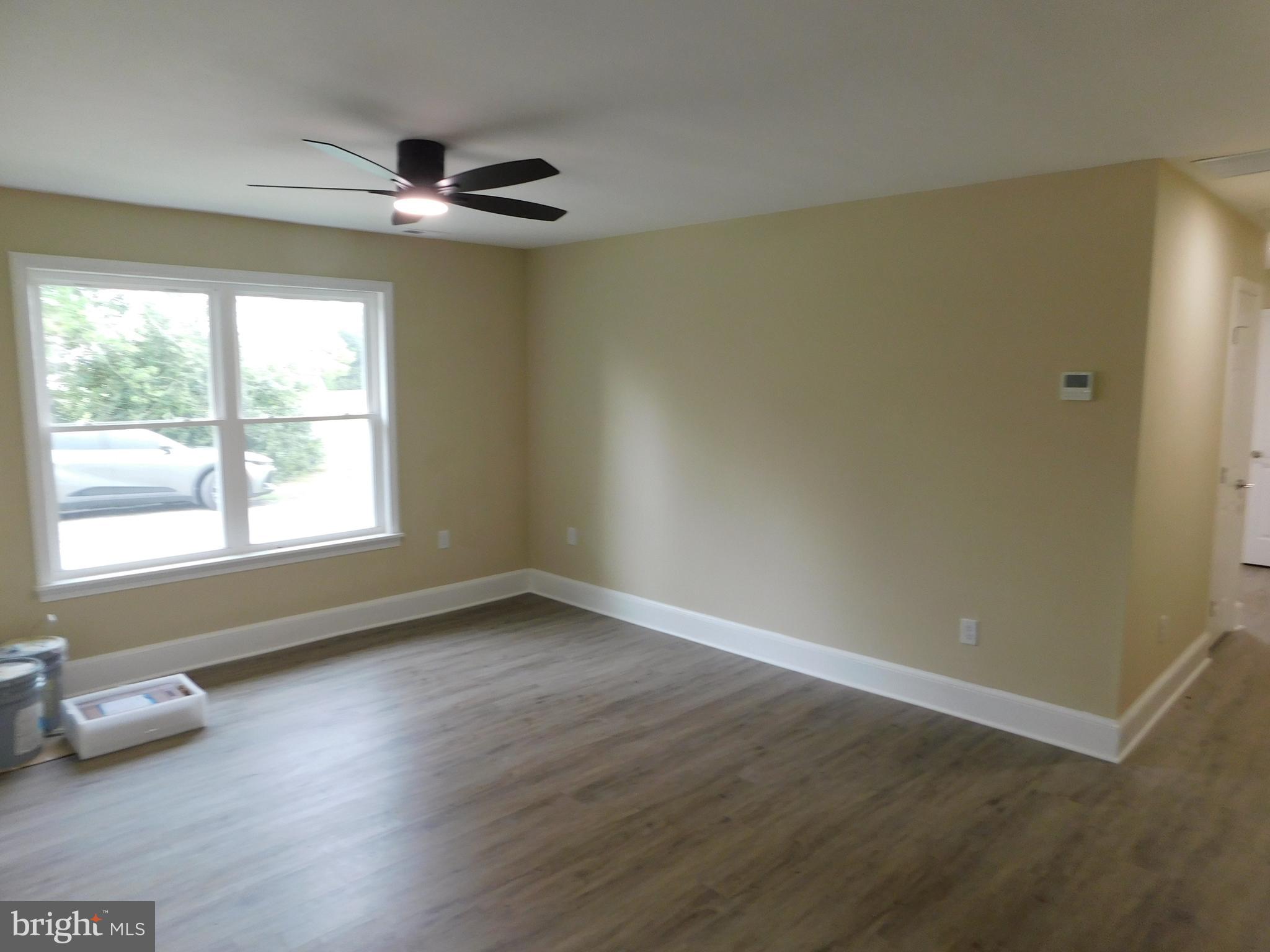 233 Hartly Road Hartly, DE 19953 - Photo 18 of 70 a view of empty room with wooden floor and fan