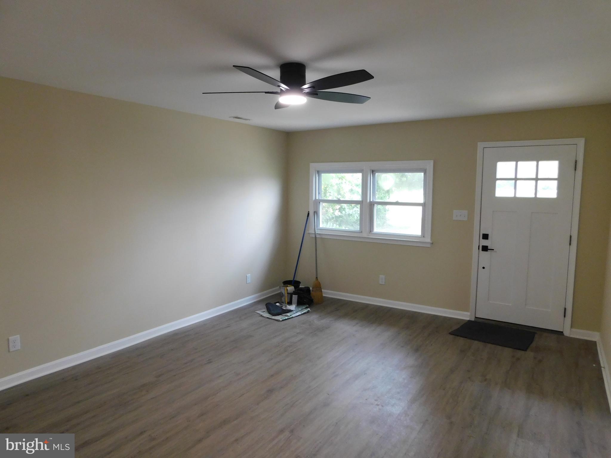 233 Hartly Road Hartly, DE 19953 - Photo 25 of 70 a view of an empty room with wooden floor and a window