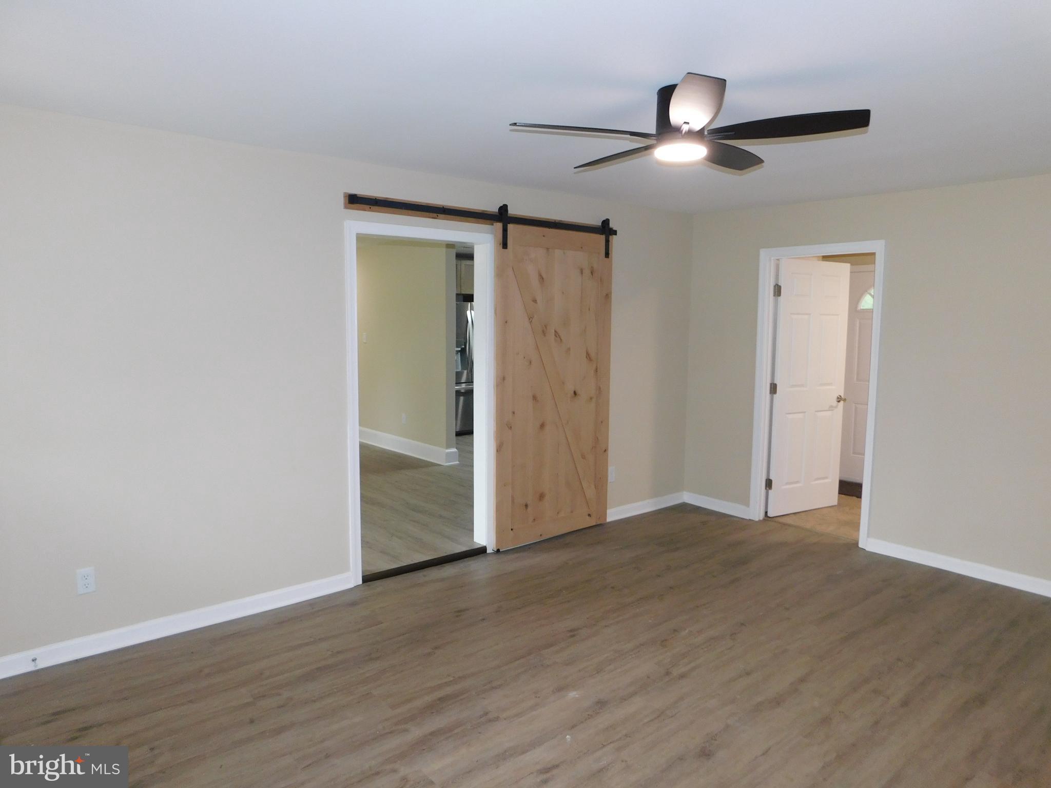 233 Hartly Road Hartly, DE 19953 - Photo 28 of 70 a view of an empty room with wooden floor