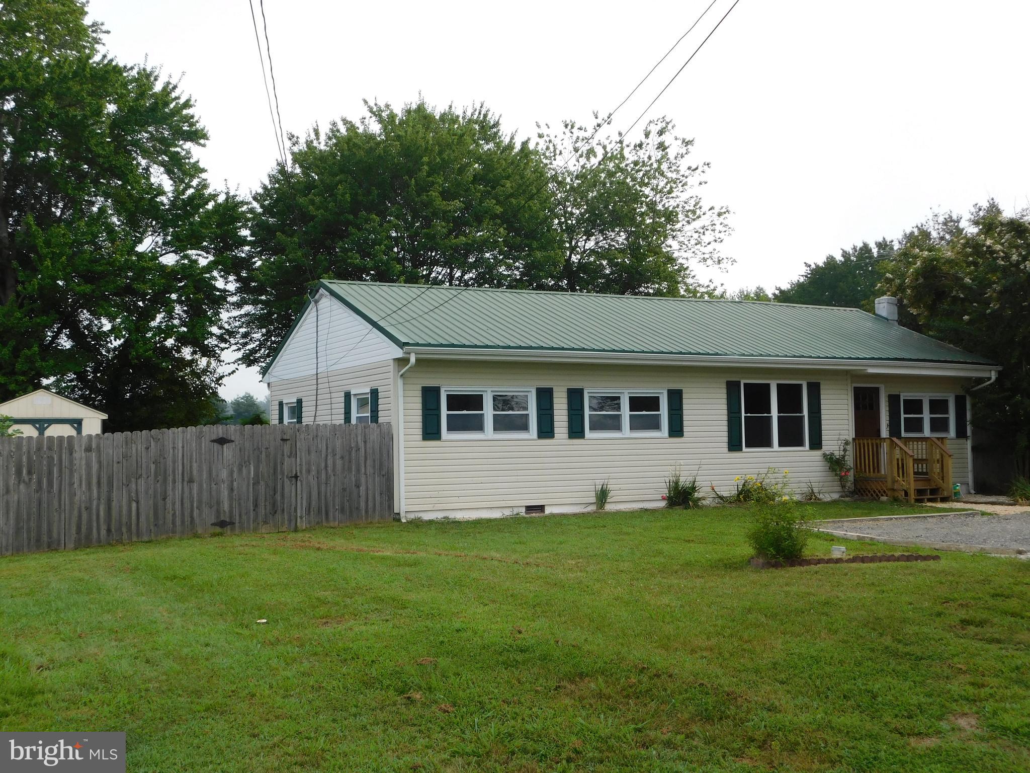 233 Hartly Road Hartly, DE 19953 - Photo 3 of 70 a front view of house with a garden and trees