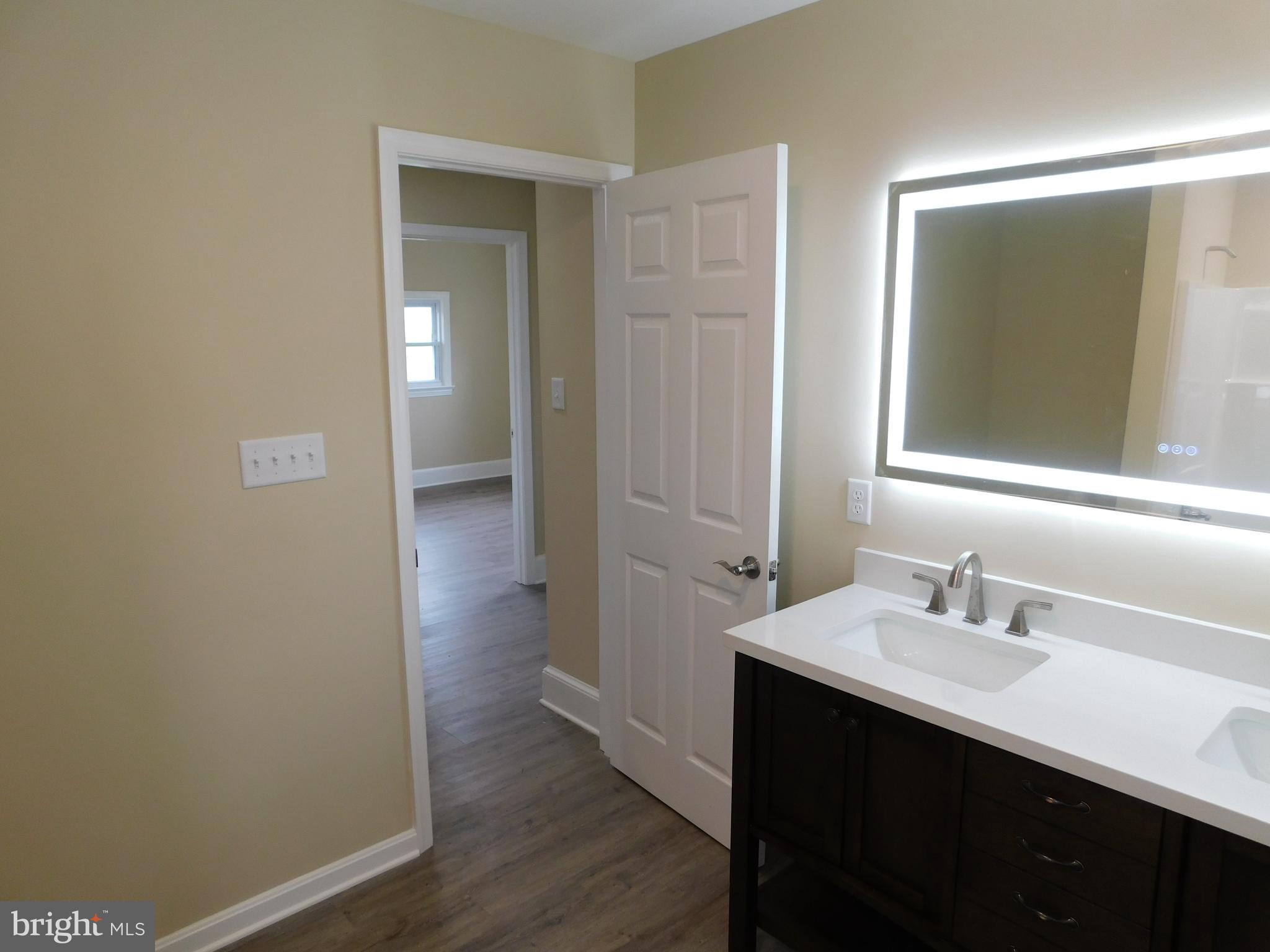 233 Hartly Road Hartly, DE 19953 - Photo 34 of 70 a bathroom with a sink and a mirror