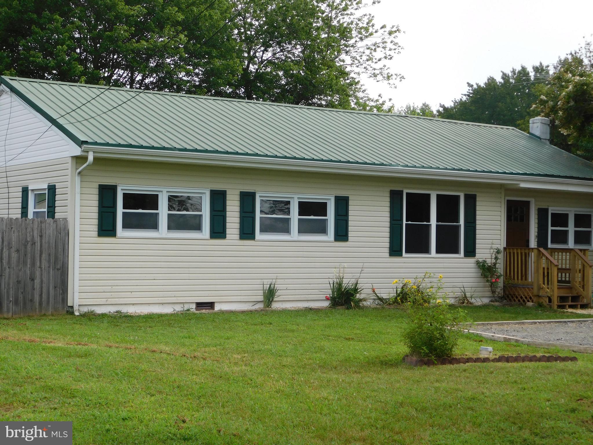 233 Hartly Road Hartly, DE 19953 - Photo 4 of 70 a front view of a house with a yard
