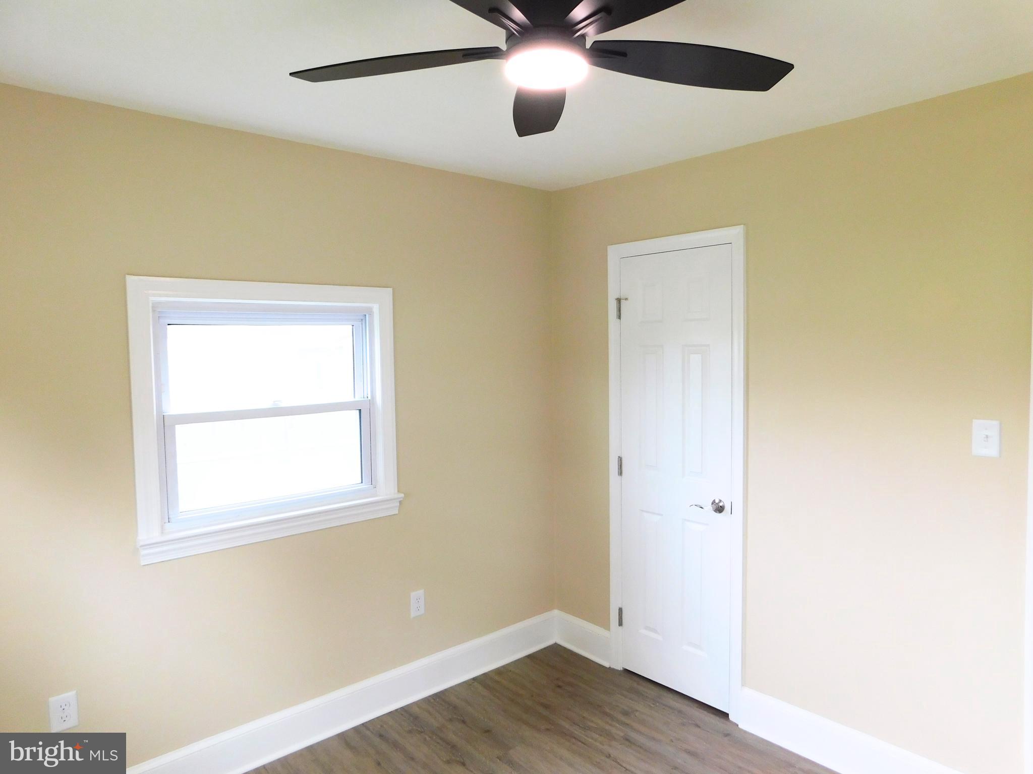 233 Hartly Road Hartly, DE 19953 - Photo 41 of 70 a view of an empty room with wooden floor and a window