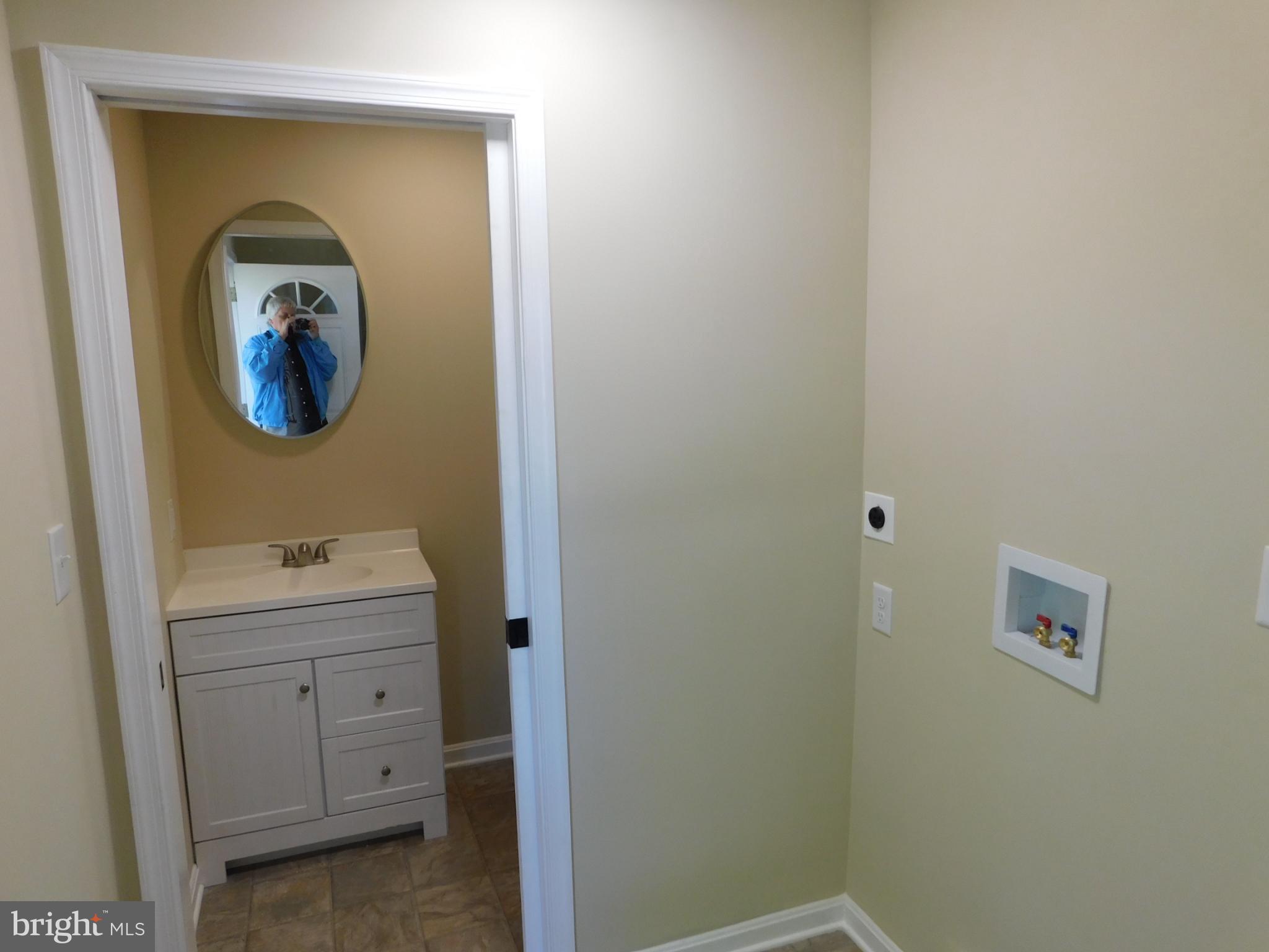 233 Hartly Road Hartly, DE 19953 - Photo 42 of 70 a bathroom with a sink and mirror