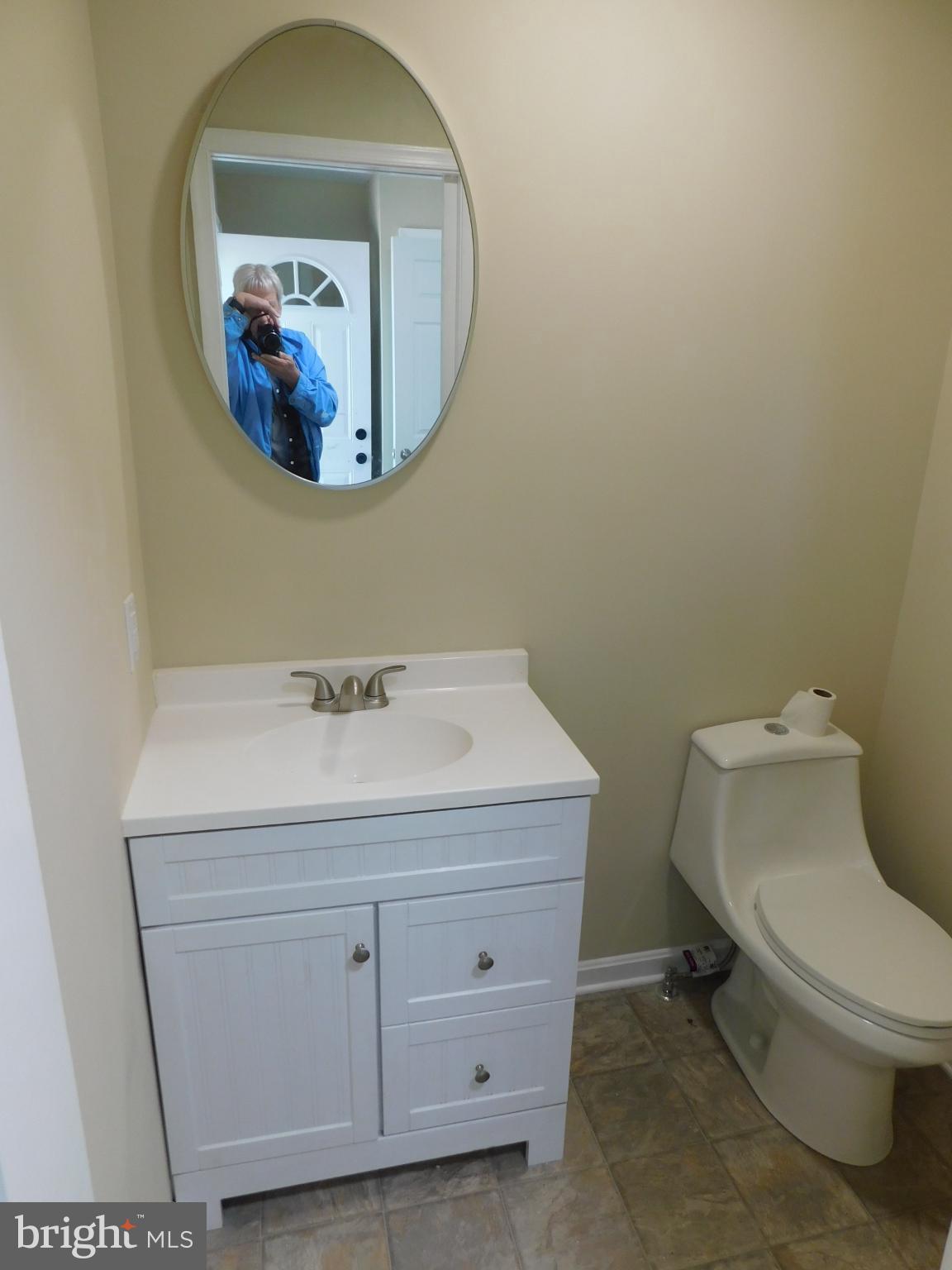 233 Hartly Road Hartly, DE 19953 - Photo 43 of 70 a bathroom with a toilet a sink and mirror
