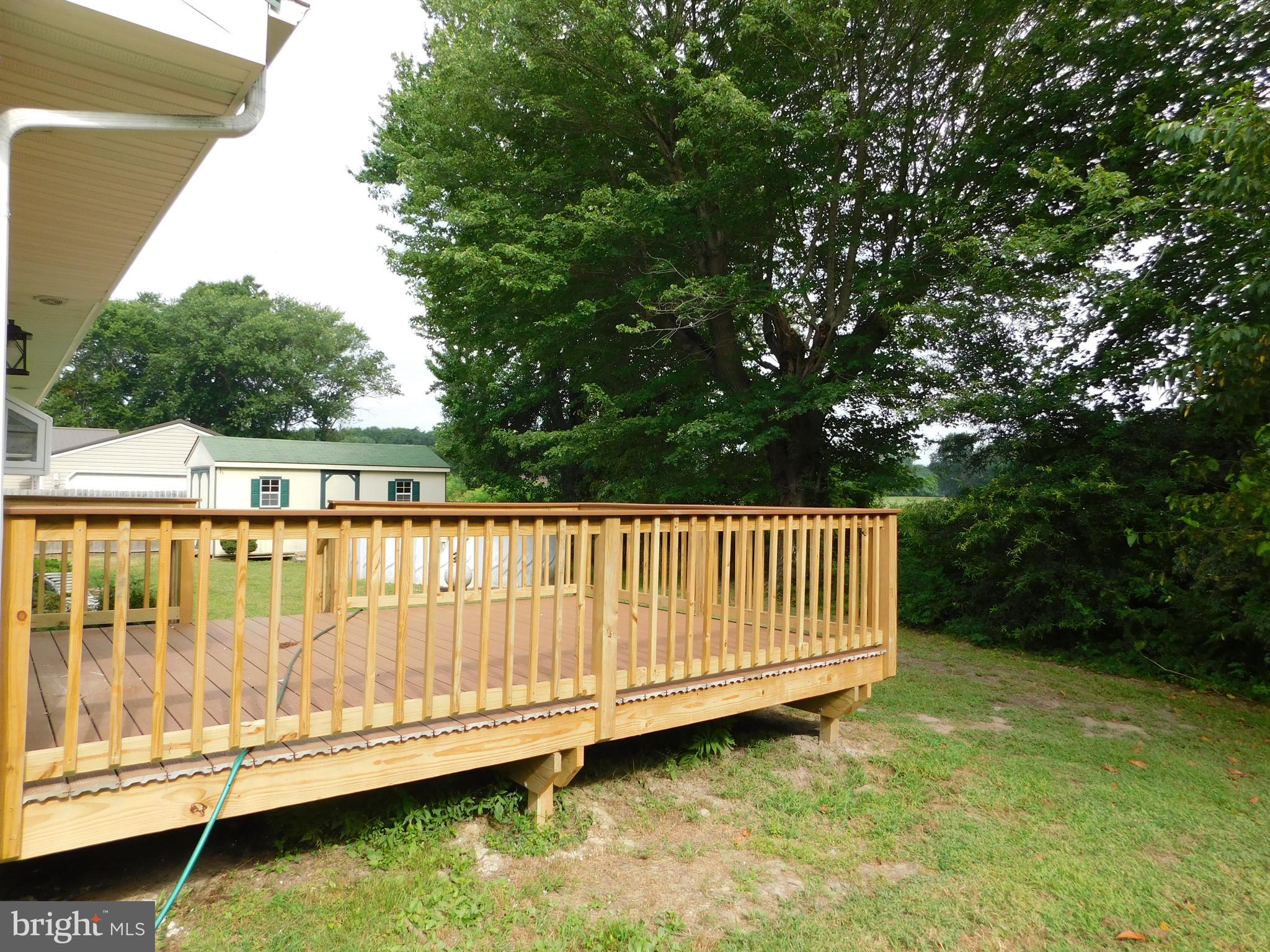 233 Hartly Road Hartly, DE 19953 - Photo 55 of 70 a view of a large swimming pool with a lake view