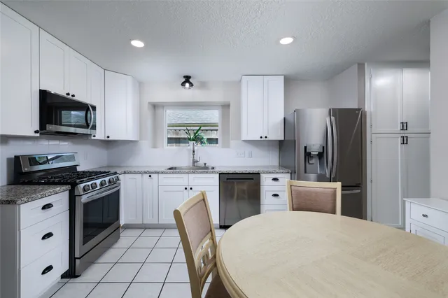 a bedroom with a bed and a table in it