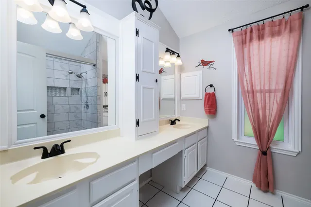 a bedroom with a bed furniture and a window