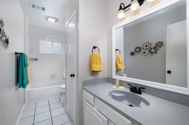 a bedroom with bed and a window