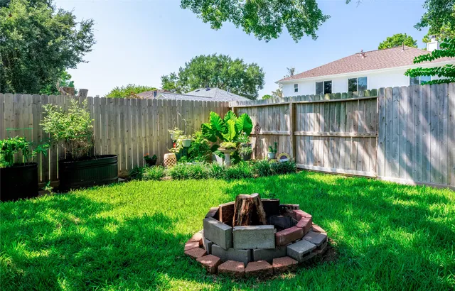 a view of backyard with green space