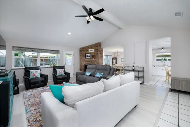 a view of a backyard with potted plants and a fountain