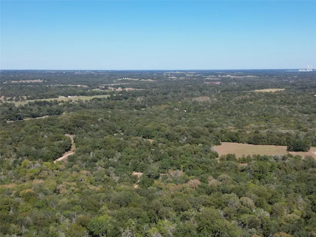 an aerial view of house with yard
