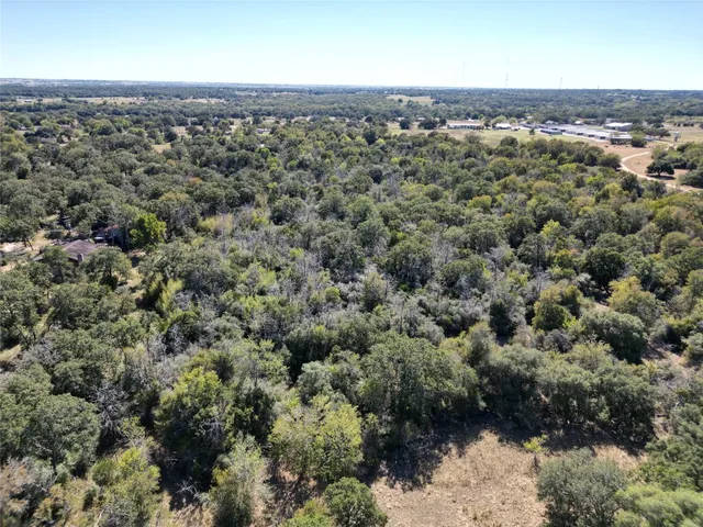 an aerial view of a houses with outdoor space
