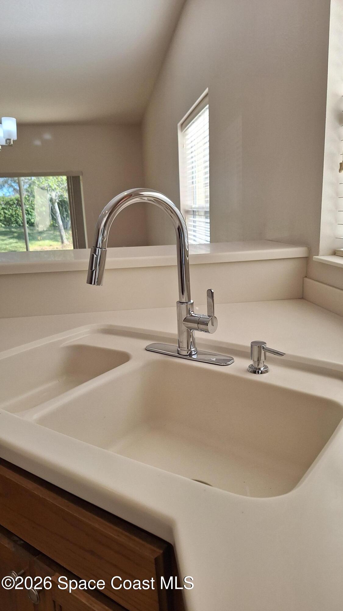 6921 Abbeyville Road Melbourne, FL 32940 - Photo 12 of 24 a close view of sink and tap