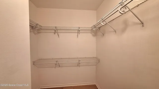 a view of a room with racks on the wall