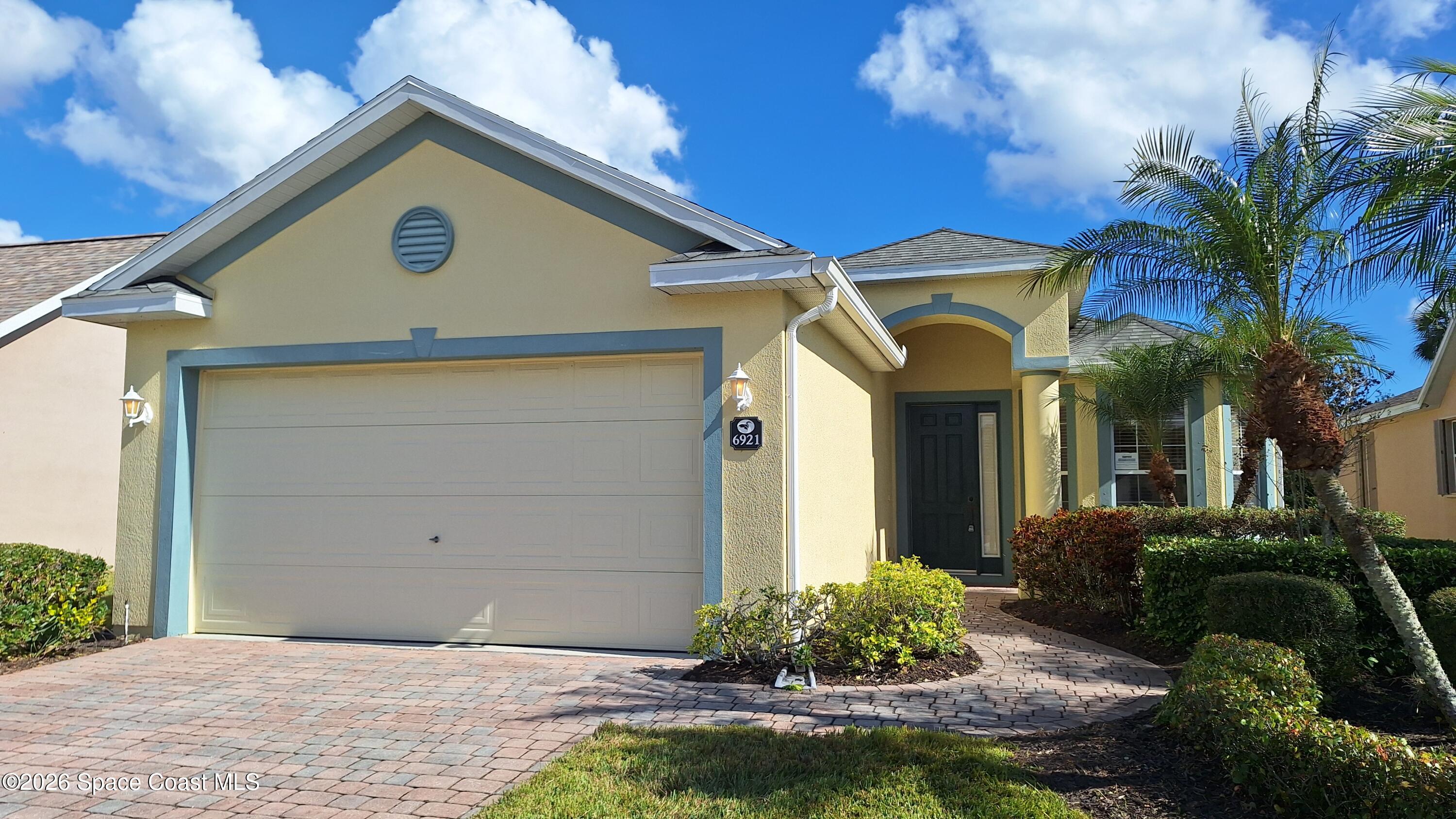 6921 Abbeyville Road Melbourne, FL 32940 - Photo 23 of 24 a front view of a house with garden