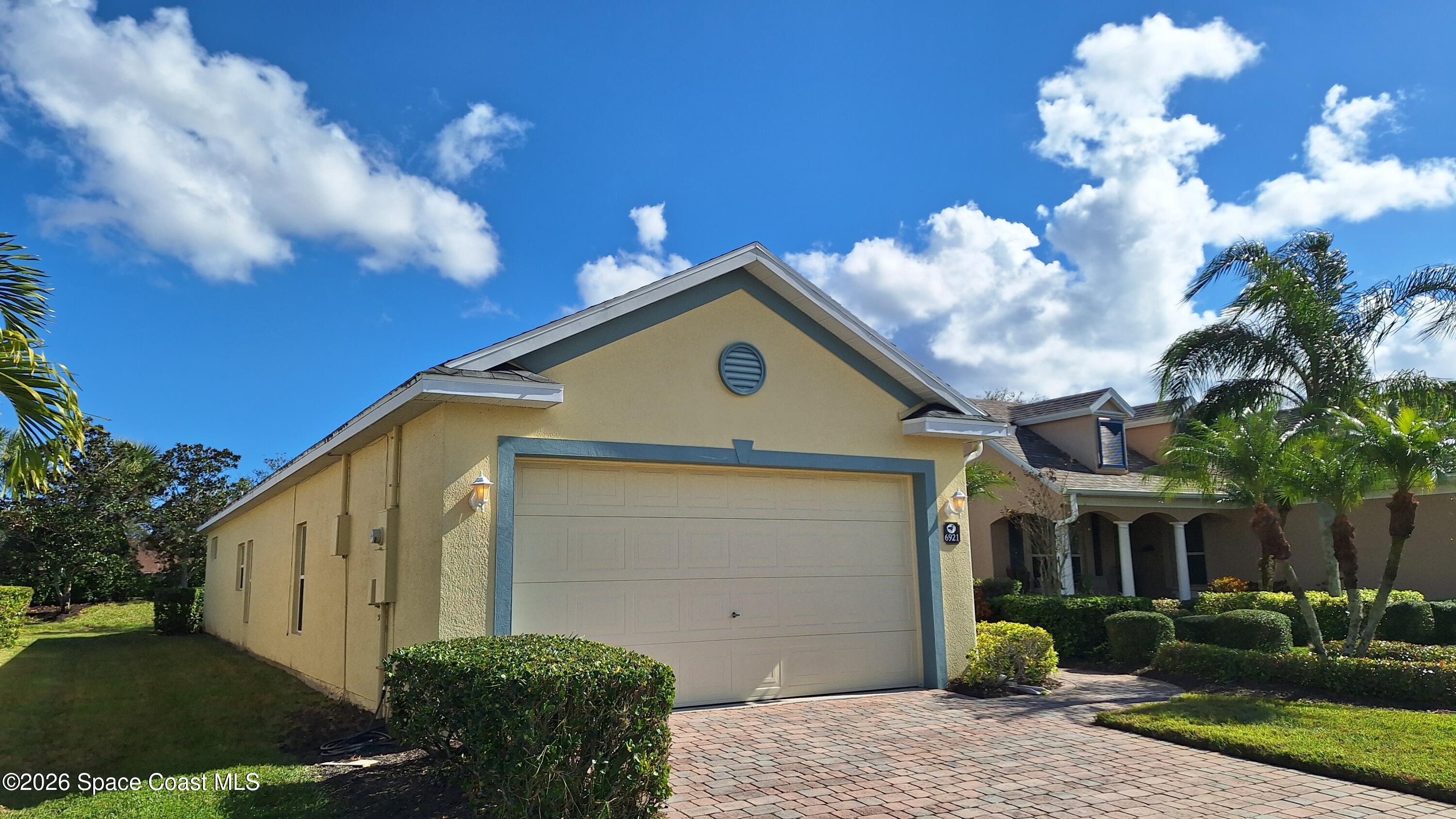 6921 Abbeyville Road Melbourne, FL 32940 - Photo 24 of 24 a front view of a house with garden