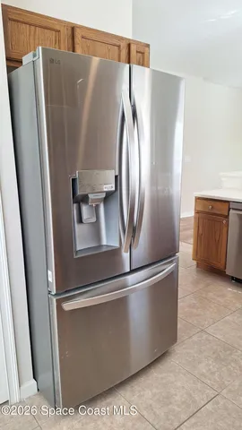 a view of a refrigerator in kitchen