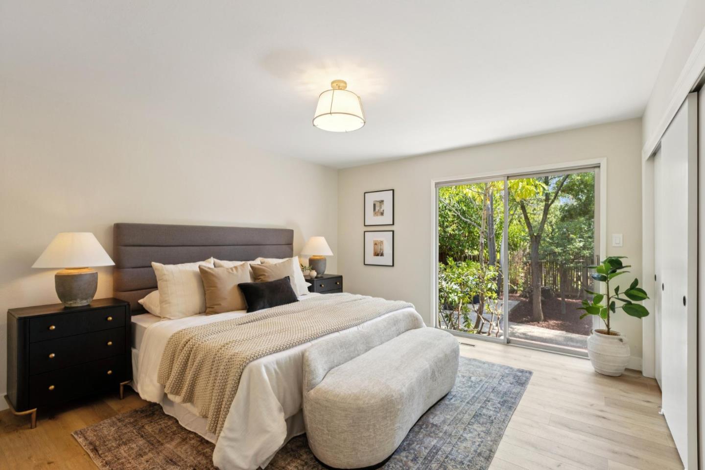 755 Santa Rita Avenue Los Altos, CA 94022 - Photo 28 of 50 a bedroom with a large bed and a large window