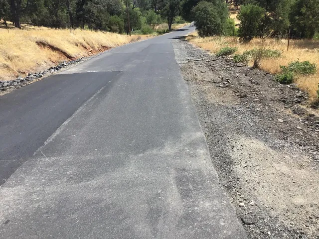a view of a yard covered in snow
