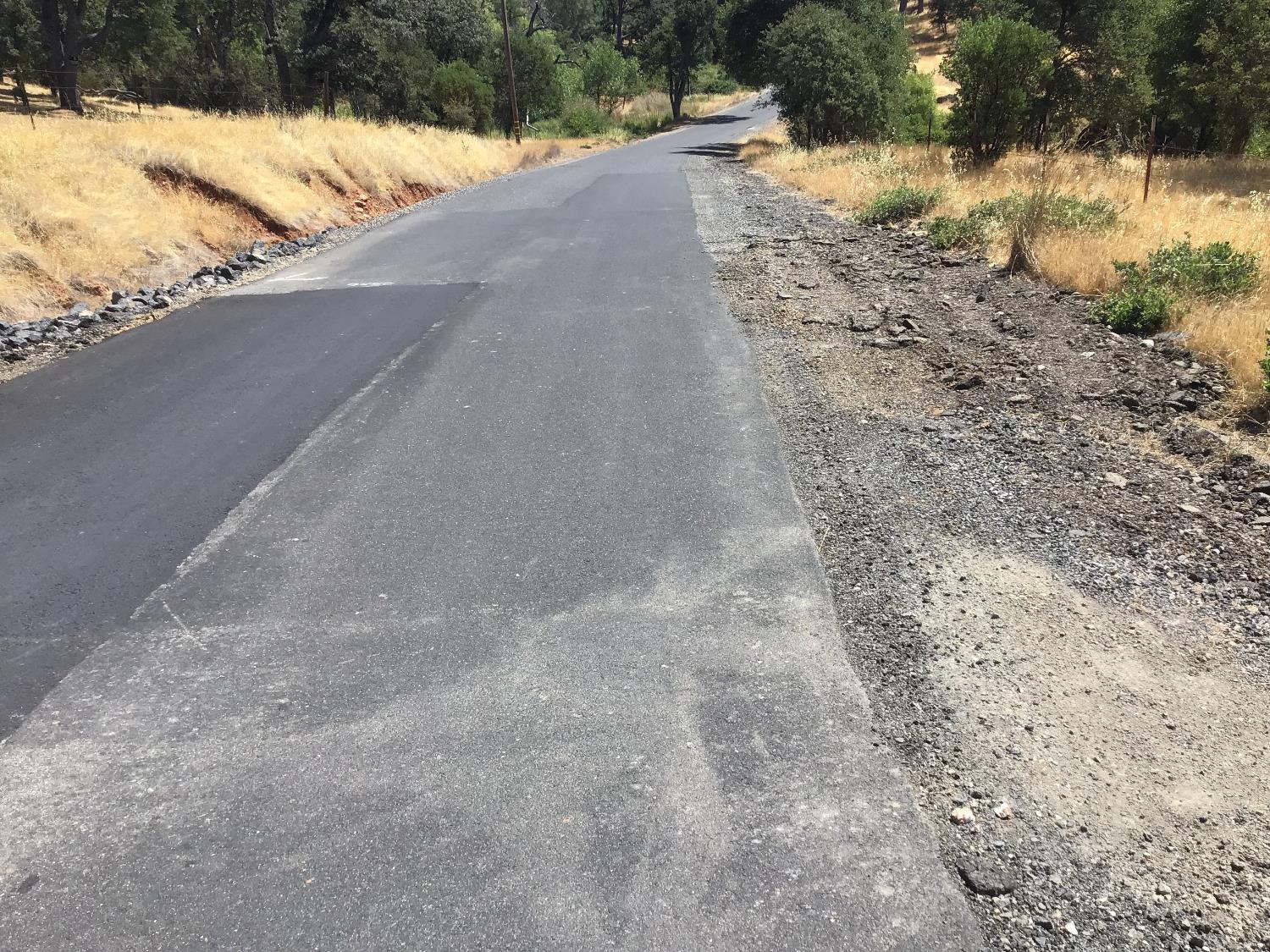 3071 Chestnut Way Angels Camp, CA 95222 - Photo 1 of 4 a view of a yard covered in snow