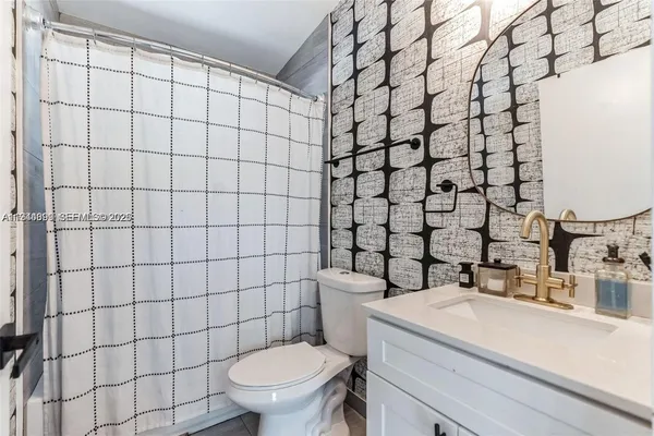 a bathroom with a sink and a toilet