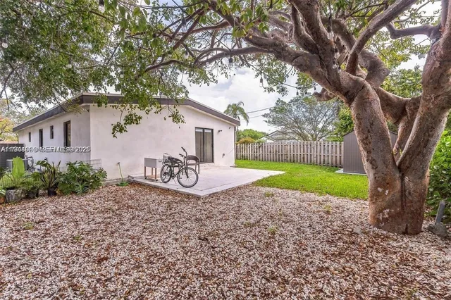a house with trees in the background