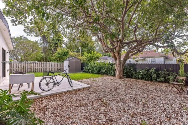a view of a bench in a backyard