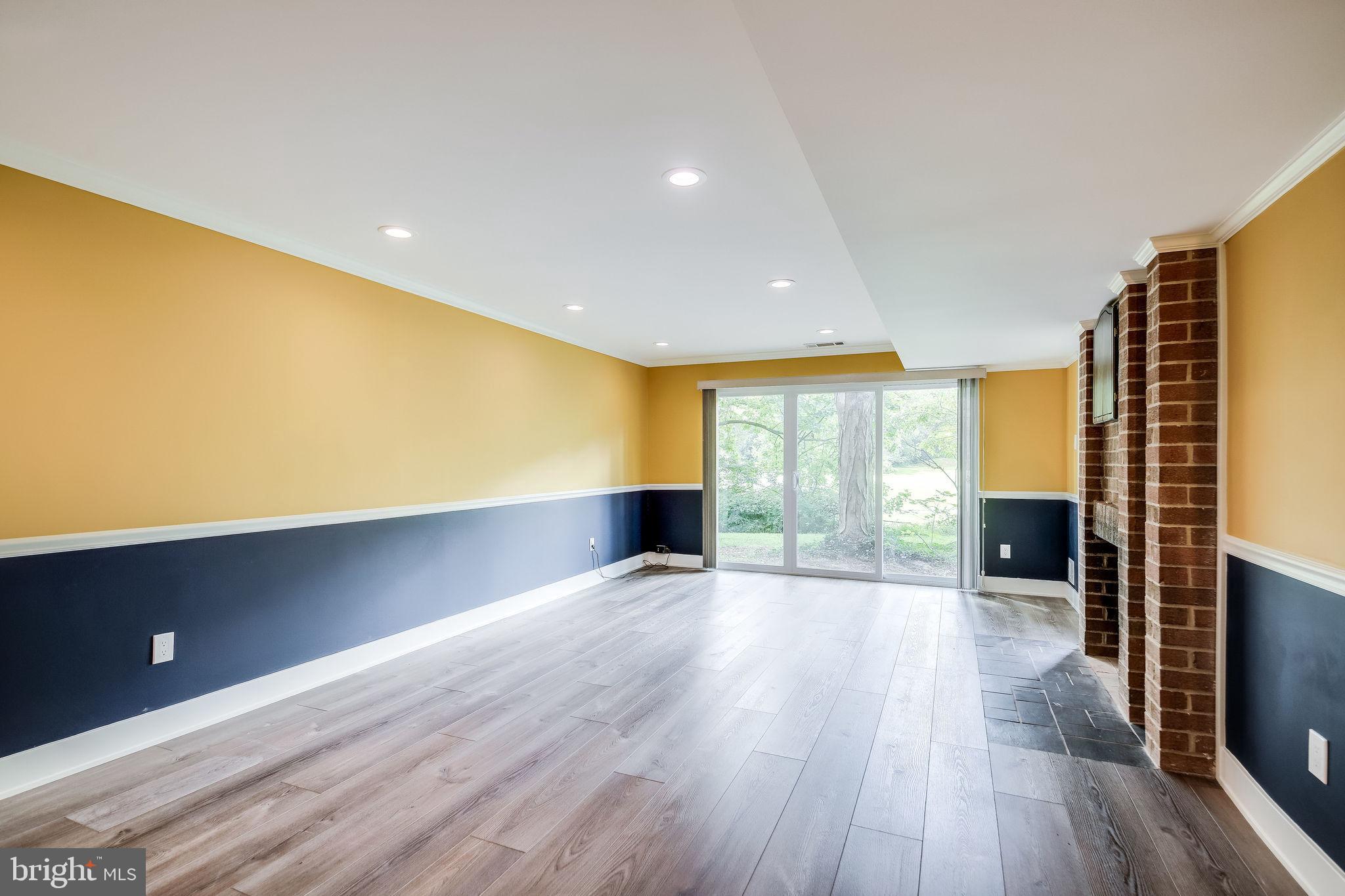 11629 Hunters Green Court Reston, VA 20191 - Photo 34 of 50 Large family room - lower level (WVU colors!)