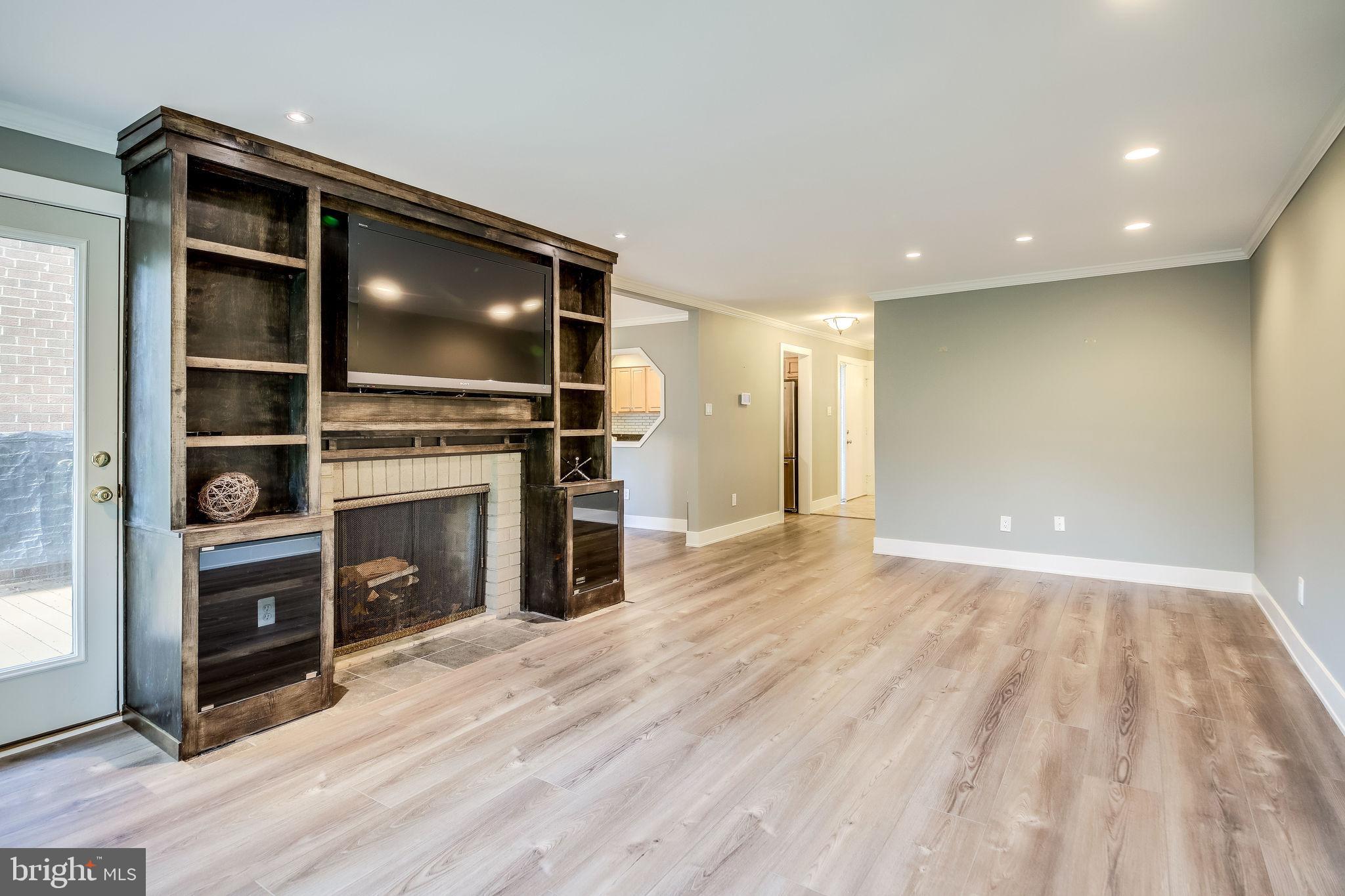 11629 Hunters Green Court Reston, VA 20191 - Photo 10 of 50 Living rm w/ wood burning FP and built-ins + TV