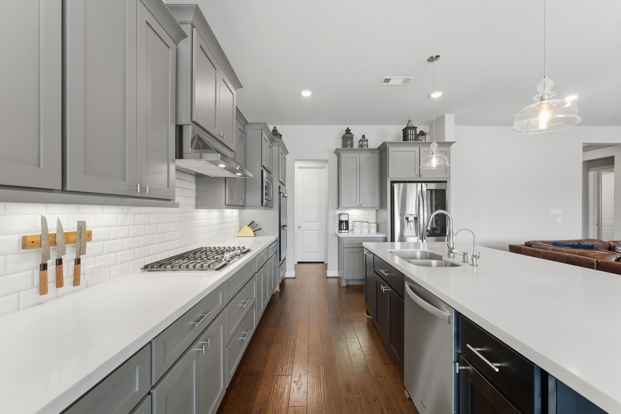 28117 Woodland Bend Way Spring, TX 77386 - Photo 22 of 48 Kitchen is complete with ample cabinets, cooktop and double ovens.