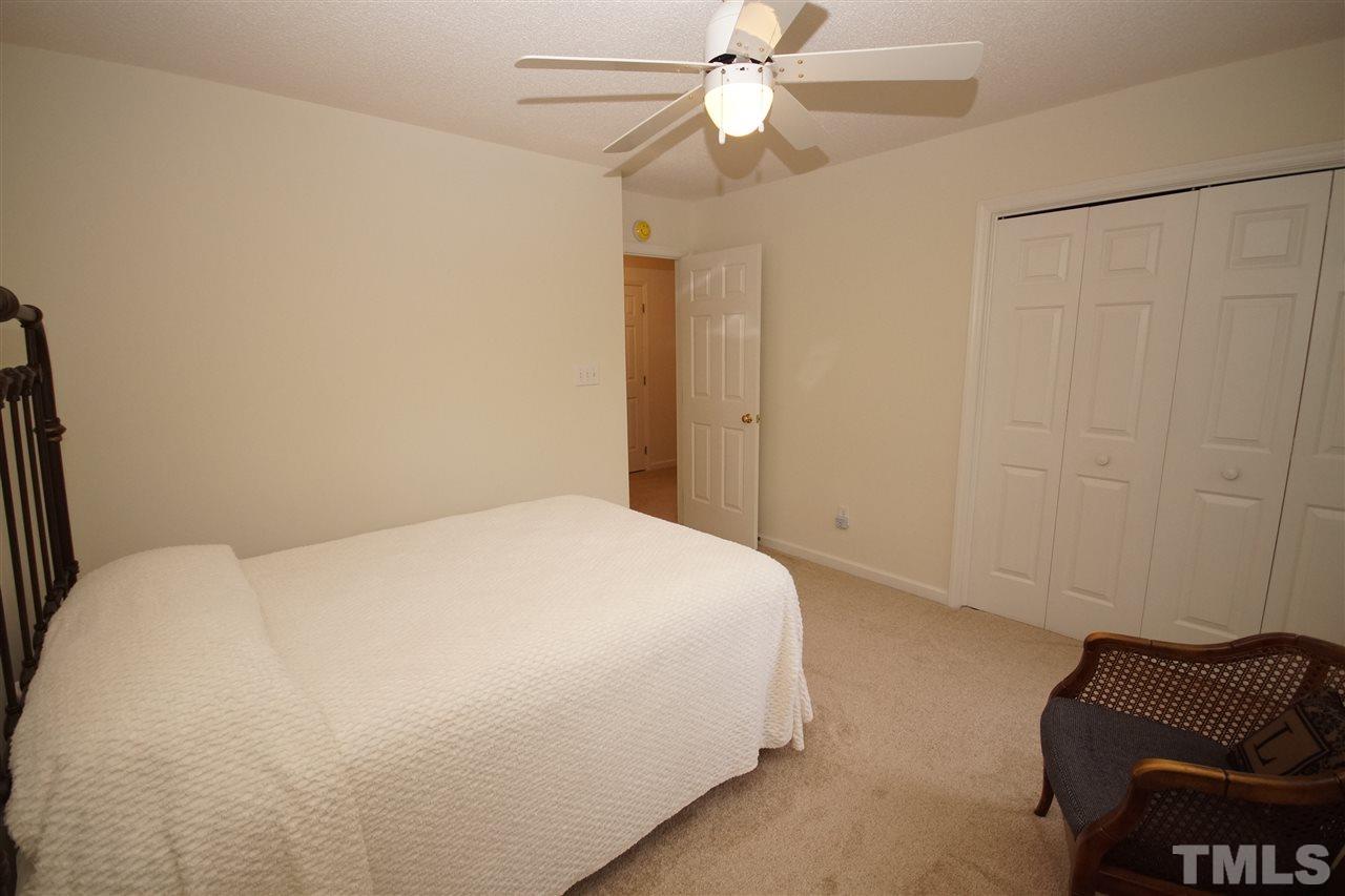 5249 Fairmead Circle Raleigh, NC 27613 - Photo 18 of 25 a bedroom with a bed and furniture