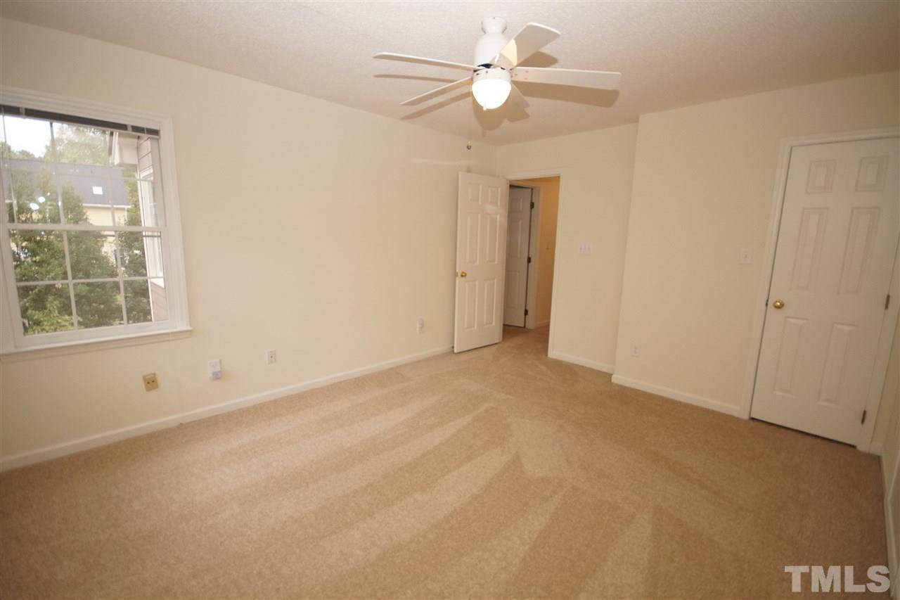 5249 Fairmead Circle Raleigh, NC 27613 - Photo 20 of 25 an empty room with a window and a ceiling fan