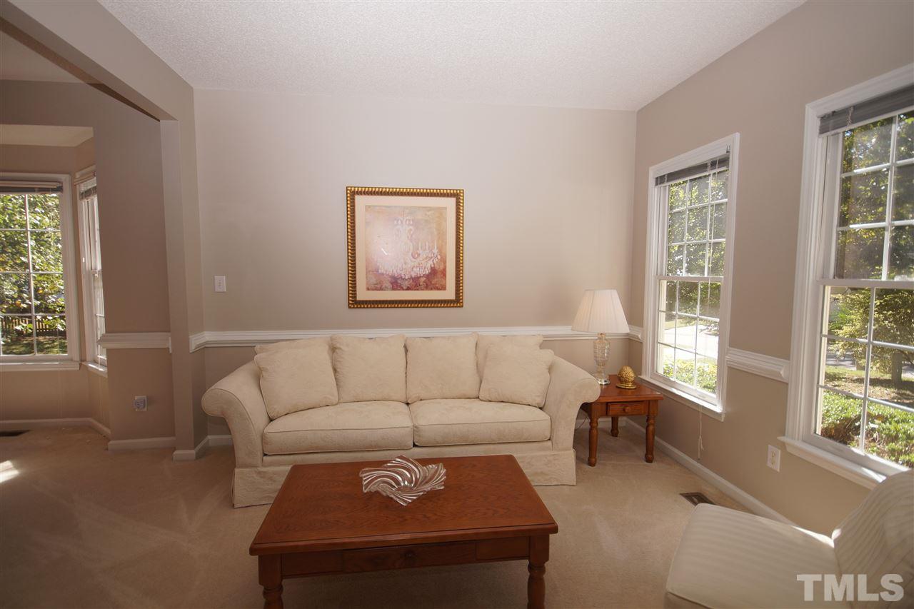 5249 Fairmead Circle Raleigh, NC 27613 - Photo 3 of 25 a living room with furniture and a window