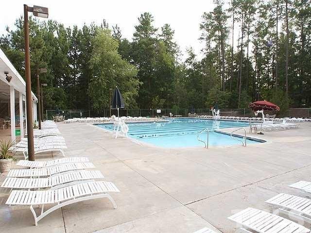 5249 Fairmead Circle Raleigh, NC 27613 - Photo 25 of 25 a view of a swimming pool with a patio