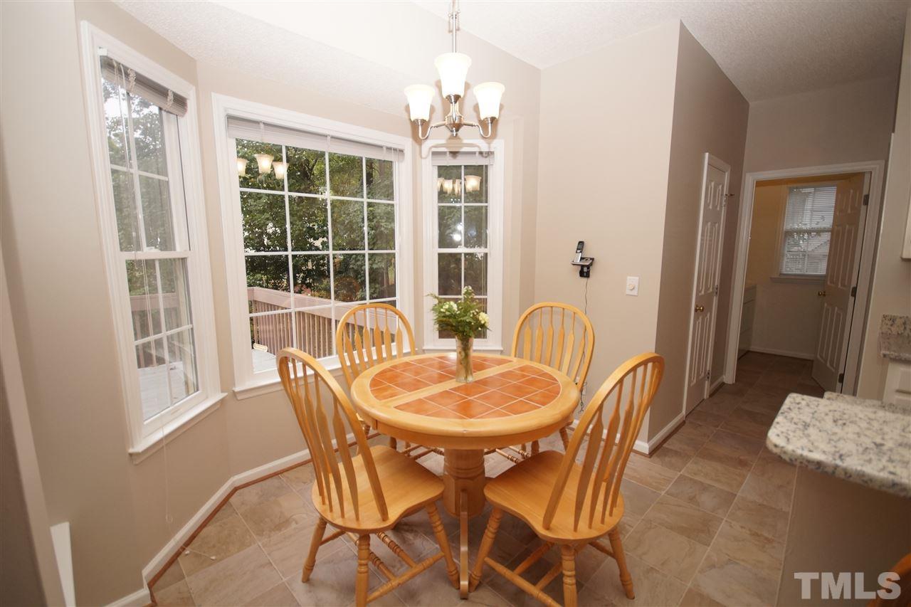 5249 Fairmead Circle Raleigh, NC 27613 - Photo 10 of 25 a dining room with furniture window and outside view