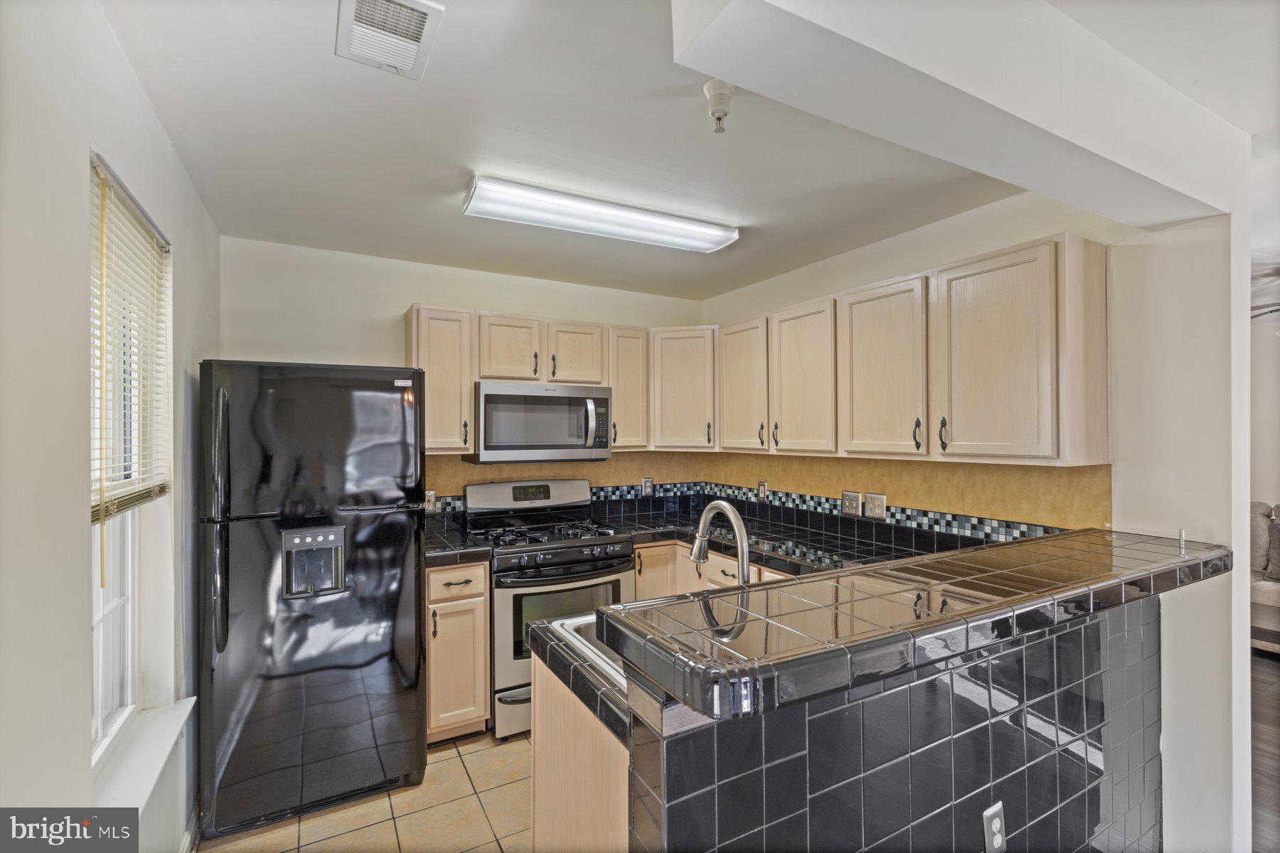 8901 Stone Creek Place, Unit T3 Pikesville, MD 21208 - Photo 12 of 25 Kitchen