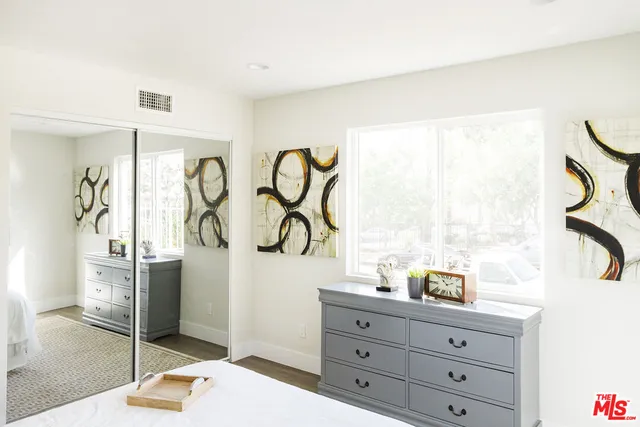 a kitchen with stainless steel appliances a refrigerator and a stove top oven