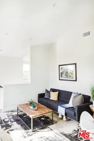 a view of a living room with a wooden floor