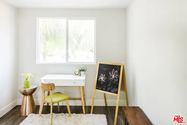 a bedroom with a bed and dresser