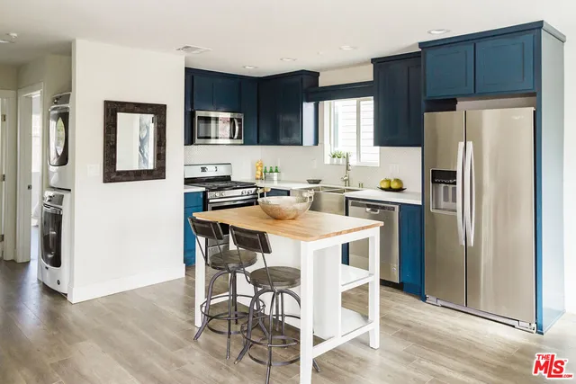 a kitchen with a stove and a microwave