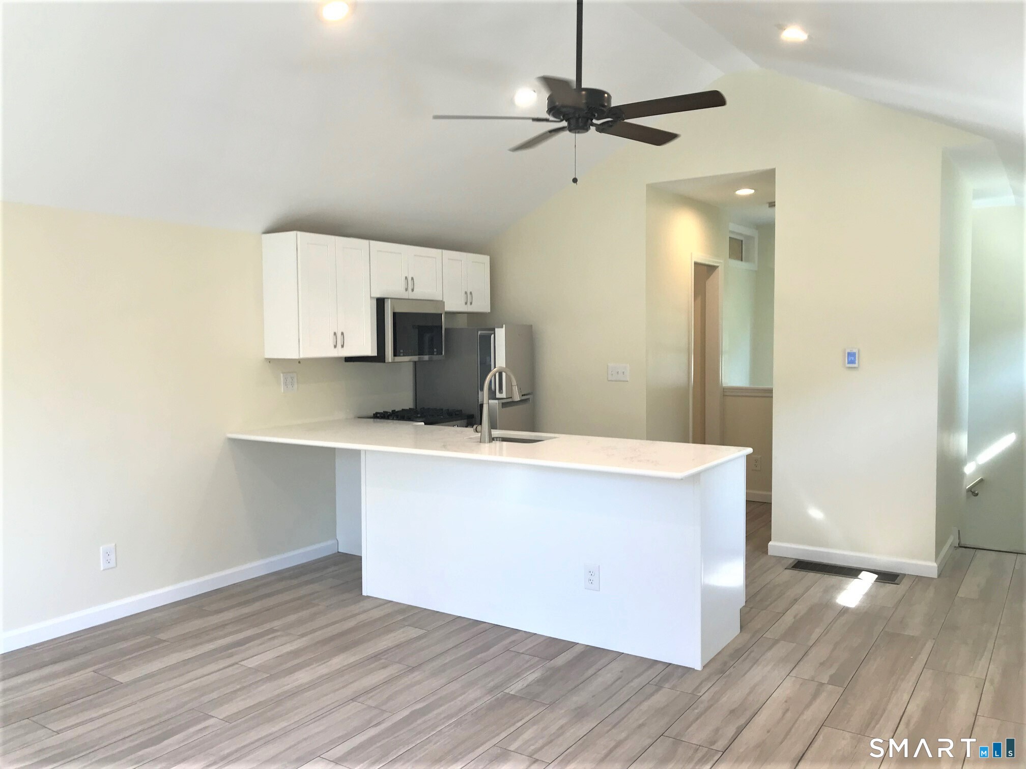3509 Redding Road Fairfield, CT 06824 - Photo 17 of 27 a view of kitchen with granite countertop cabinets and stainless steel appliances