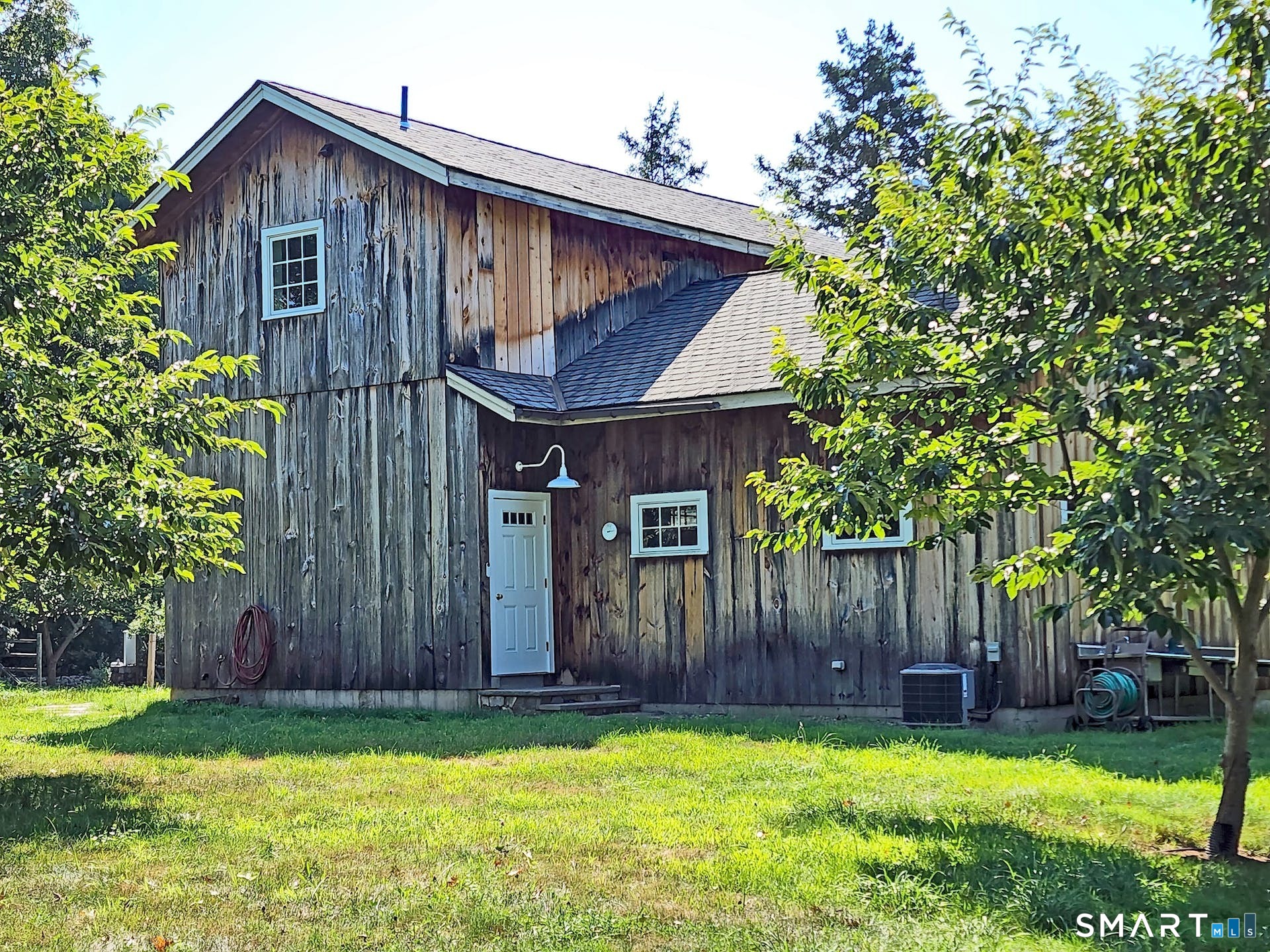 3509 Redding Road Fairfield, CT 06824 - Photo 4 of 27 a view of a house with a yard and wooden fence