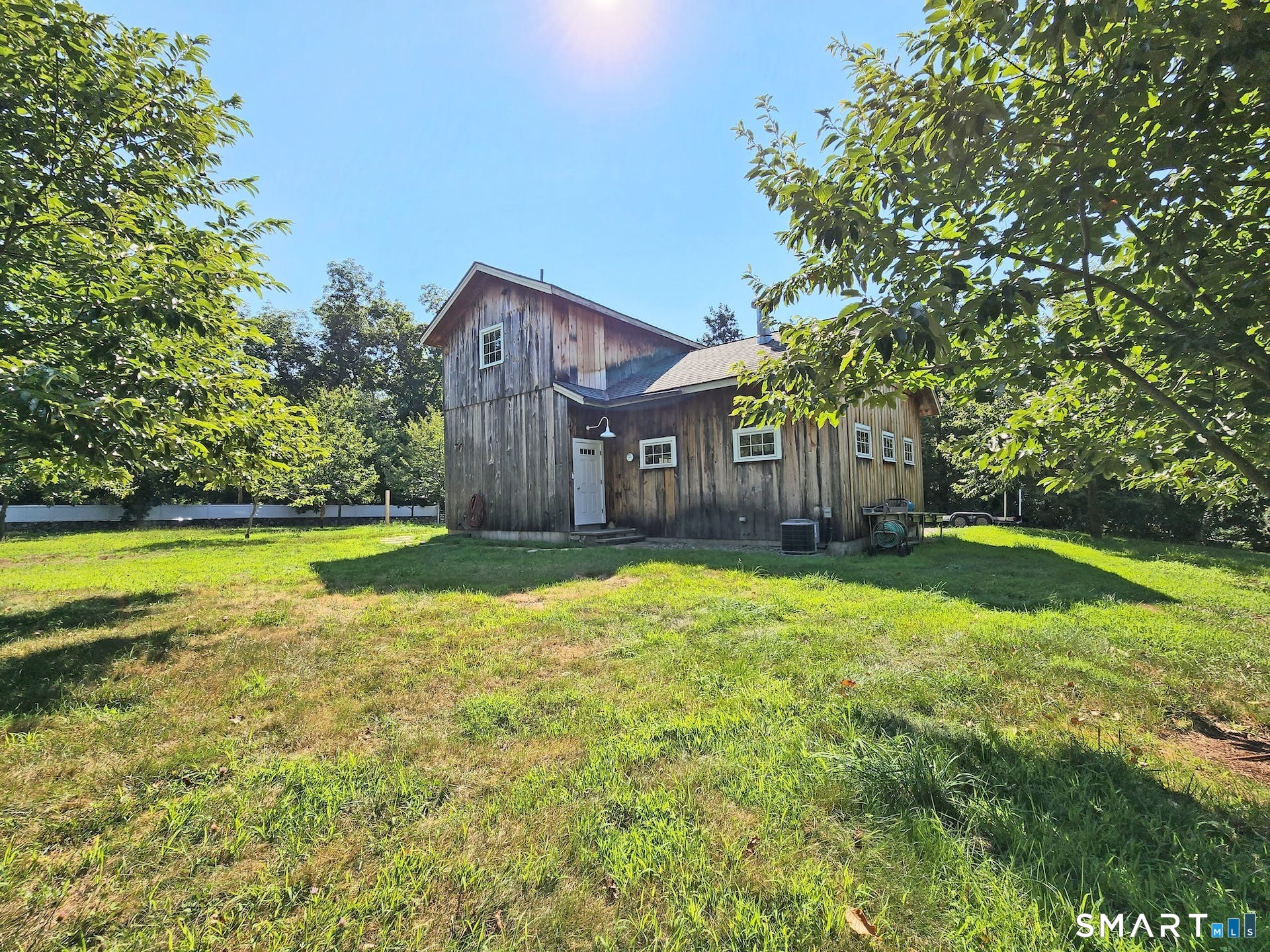 3509 Redding Road Fairfield, CT 06824 - Photo 5 of 27 a view of a house with a yard and sitting area