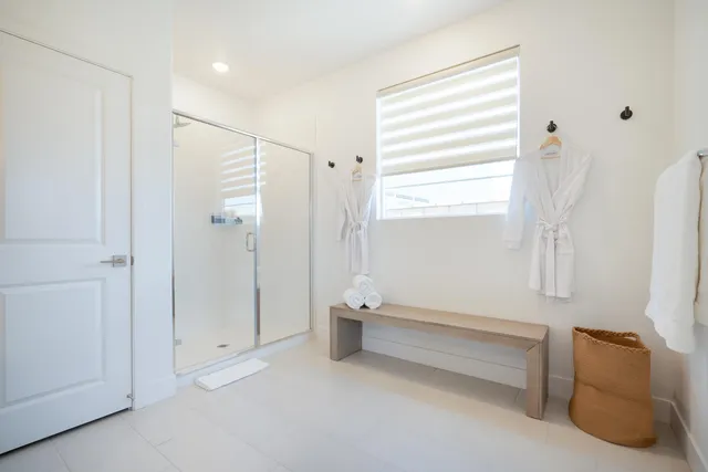 a bathroom with a bathtub and a shower