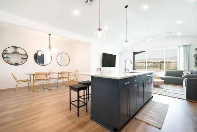 a kitchen with a sink cabinets and window