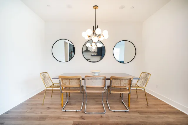 a group of chairs sitting on a wooden floor