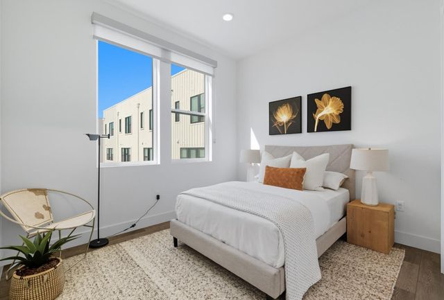 a bathroom with a sink a toilet a glass door a shower and a mirror